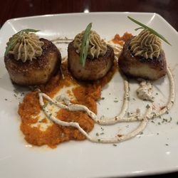 Craft Bistro - Scallops over sun-dried tomato sriracha with duck liver foie mousse.