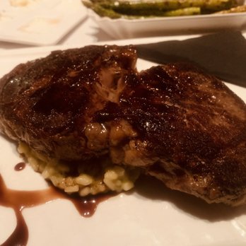 Market To Table - Delmonico steak with peas risotto over a short rib sauce - New American Near Me - Winter Garden, Florida Market To Table - Delmonico steak with peas risotto over a short rib sauce - New American Near Me - Winter Garden, Florida