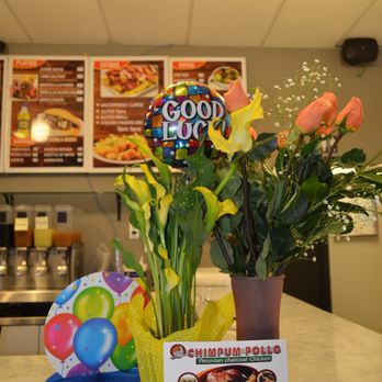 Chimpum Pollo - a bunch of flowers on a counter - Peruvian Near Me - Stafford, Virginia