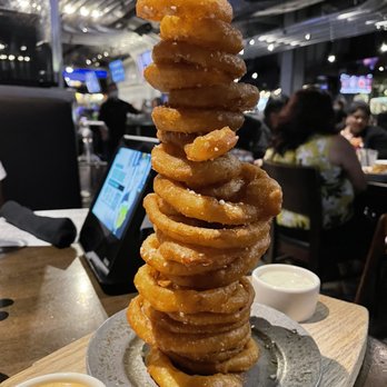 Yard House - Onion Ring Tower** - New American Near Me - San Jose, California Yard House - Onion Ring Tower** - New American Near Me - San Jose, California