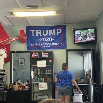 Happy Hangar Cafe - A flag that immediately announces that many customers won't feel welcome here. - Breakfast & Brunch Near Me - Lutz, Florida