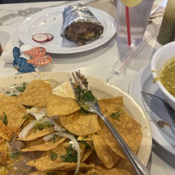 Fuego Cravings - Chilaquiles's with sauce aside and a breakfast burrito. Soo good! - Mexican Near Me - Highland, California Fuego Cravings - Chilaquiles's with sauce aside and a breakfast burrito. Soo good! - Mexican Near Me - Highland, California