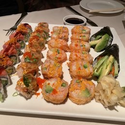 Assorted platter including Alaskan hand roll, and Christmas roll, volcano roll Assorted platter including Alaskan hand roll, and Christmas roll, volcano roll