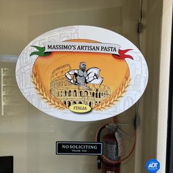 Massimo’s Artisan Pasta - Logo on the door features a likeness of the owner as the Roman.