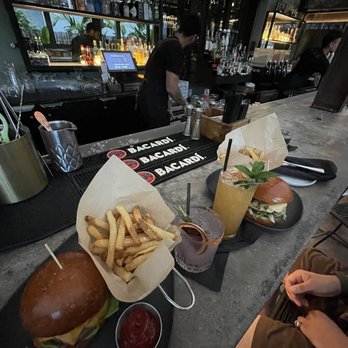 Le Chick - Umeloma drink/La Reina on the left Mai pie drink/ Heinz Burger on the right - Cocktail Bars Near Me - Miami, Florida Le Chick - Umeloma drink/La Reina on the left Mai pie drink/ Heinz Burger on the right - Cocktail Bars Near Me - Miami, Florida