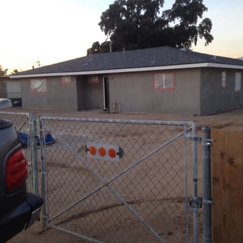 Arlington Construction - a fenced in yard with a house in the background - General Contractors Near Me - Norco, California Arlington Construction - a fenced in yard with a house in the background - General Contractors Near Me - Norco, California