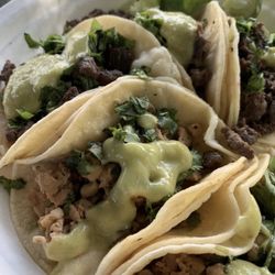 Tacos de Pollo (chicken) and Asada (beef) with avocado salsa