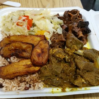 Aunty Joy's Jerk & Pizza - The 2 meat combo (oxtail and goat curry) - Caribbean Near Me - Chicago, Illinois Aunty Joy's Jerk & Pizza - The 2 meat combo (oxtail and goat curry) - Caribbean Near Me - Chicago, Illinois