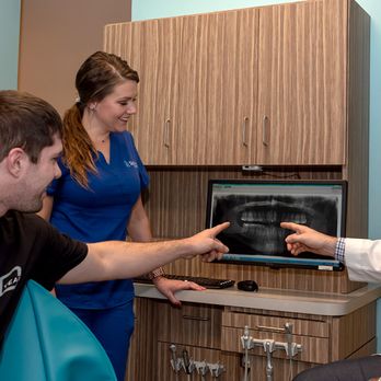 Smith Dental - Looking at X-rays - Orthodontists Near Me - Smyrna, Tennessee Smith Dental - Looking at X-rays - Orthodontists Near Me - Smyrna, Tennessee