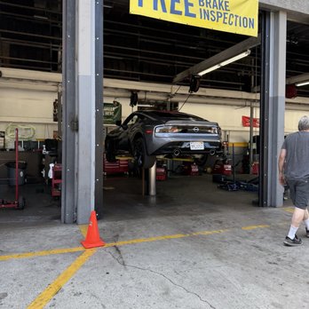 Just Tires - Car on lift, getting tires replaced - Tires Near Me - Flintridge, California Just Tires - Car on lift, getting tires replaced - Tires Near Me - Flintridge, California