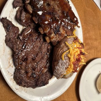 Texas Roadhouse - 12 oz ribeye w/ribs and loaded baked potato - Steakhouses Near Me - Jackson, Tennessee