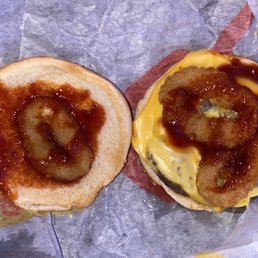 ordered a Bacon Cheeseburger, but instead got a cheeseburger with Onion Rings and barbecue sauce.