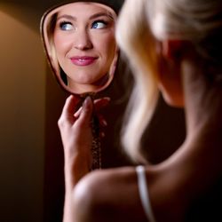 Jay Grubb Photography & Video - Bride getting ready in hand mirror with blue eyes