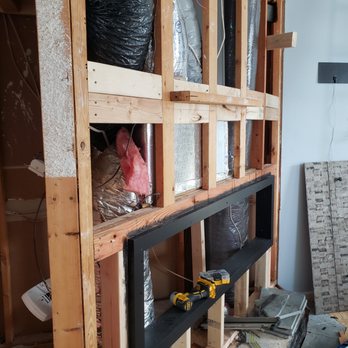 Believe Enterprise - Rock wall/ Fireplace installation - Painters Near Me