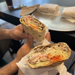 Chicken shawarma wrap made with fresh dough and sauce. Chicken shawarma wrap made with fresh dough and sauce.