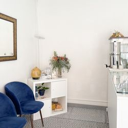 Artemisia Acupuncture and Apothecary - Step into our cozy reception room, where a warm welcome and a calming atmosphere await you.