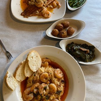 Half Shell Oyster House - Orleans shrimp and grits, turnip greens, hush puppies and Orleans red fish. - Seafood Near Me - Biloxi, Mississippi