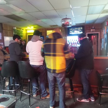 The Corner - a group of people at a bar - Dive Bars Near Me - Aurora, Illinois