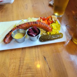 Linguica sausage protein platter with pickled samplers. Linguica sausage protein platter with pickled samplers.