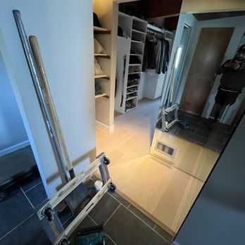 Tinos Luxury Flooring - a view of a walk - in closet - Flooring Near Me Tinos Luxury Flooring - a view of a walk - in closet - Flooring Near Me