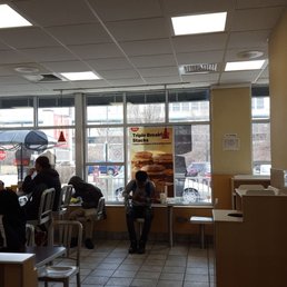 people sitting at tables in a restaurant people sitting at tables in a restaurant