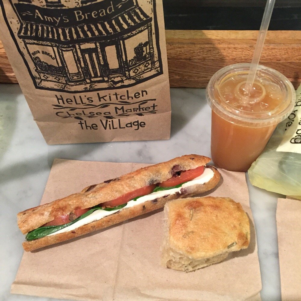 Amy's Bread - Apple juice, piece of Rosemary bread, and a tomato, basil, and mozzarella on olive bread. - Bakeries Near Me - New York, New York