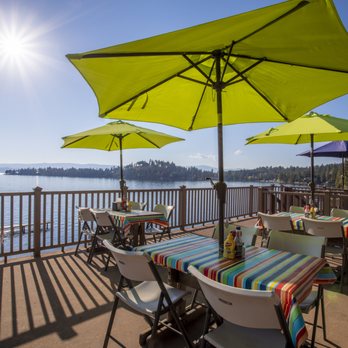 The Sitting Duck - tables and umbrellas overlooking the water - Bars Near Me - Bigfork, Montana The Sitting Duck - tables and umbrellas overlooking the water - Bars Near Me - Bigfork, Montana