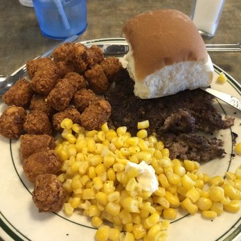 Marlin's Family Restaurant - 10 ounce hamburger steak, tater tots, corn and a roll. - New American Near Me - Mitchell, South Dakota
