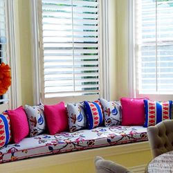 This custom window seat view is enhanced with fun fabrics in coordinating colors and patterns.