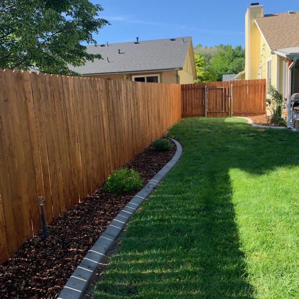 Living Waters Landscape - a backyard with a wooden fence - Landscaping Near Me Living Waters Landscape - a backyard with a wooden fence - Landscaping Near Me