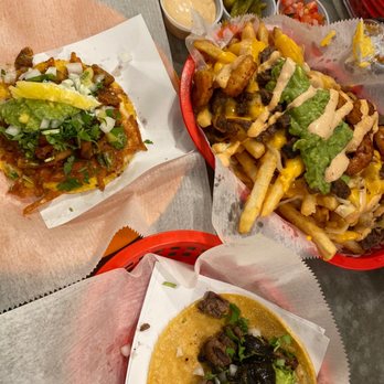 The Taco Stand - Al pastor volcan, asada taco and mar y tierra fries. - Mexican Near Me - Orange, California