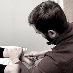 Active Rx Rehab and Wellness Center - Here's one of our PTAs working late to help out a patient who has been struggling with plantar fasciitis.