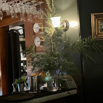 The Wallingford Dram - a bar with wine glasses hanging from it - Cocktail Bars Near Me - Kittery, Maine