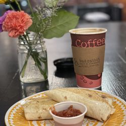 Bad Rabbit Cafe & Roastery - Bad Rabbits breakfast burrito and Americano coffee. Delicious!! Friendly staff as well. Cute spot, definitely worth the stop.