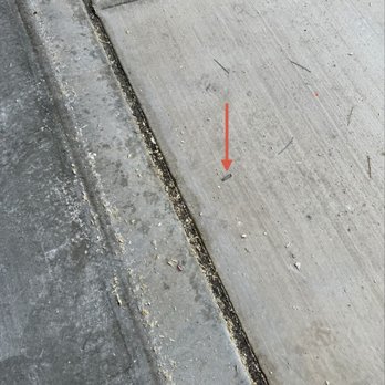 Callidus Electric - Loose screw on garage floor that could picture a tire - Electricians Near Me - Henderson, Nevada