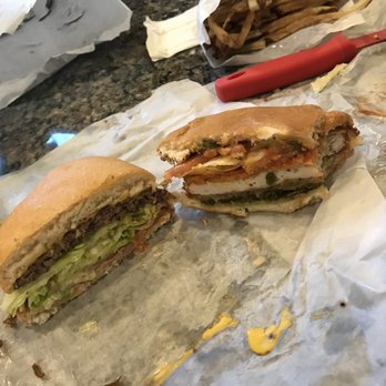 P. Terry's Burger Stand - Cheeseburger on left and limited time spicy chicken burger on right. - Fast Food Near Me - Austin, Texas