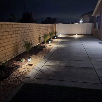 Eli Duran Concrete - a driveway with lights on - Masonry/Concrete Near Me Eli Duran Concrete - a driveway with lights on - Masonry/Concrete Near Me