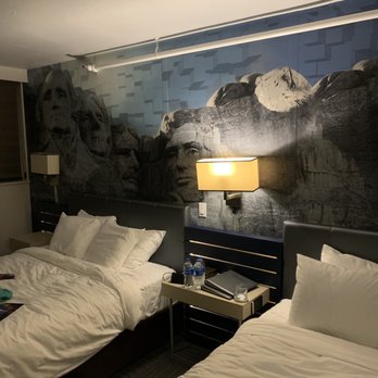 The Rushmore Hotel & Suites - Mount Rushmore mural in bedroom - Hotels Near Me - Rapid City, South Dakota