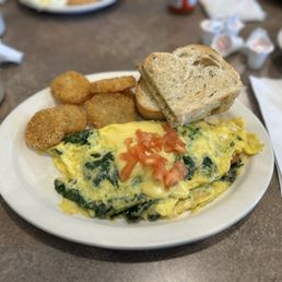 Spinach tomato omelette with their newly added potato pancakes (similar to hash browns) are a must!!!
