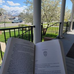 Reading on their awesome patio while my hair is dying.
