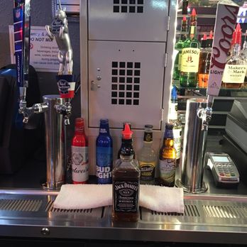 Lucky's Pub - a bar counter with a variety of beverages - Sports Bars Near Me - Salem, Oregon