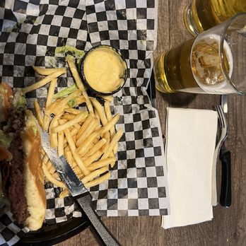 The Castle Bar & Grille - The Castle special, quacamole burger with fries and a nice cold bud light. - Burgers Near Me - Littleton, Colorado The Castle Bar & Grille - The Castle special, quacamole burger with fries and a nice cold bud light. - Burgers Near Me - Littleton, Colorado