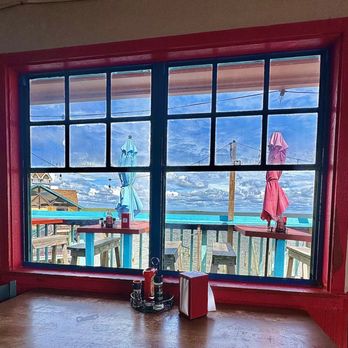The Tipsy Cow Bar and Grill - Ocean breeze colorful space and fresh seafood - Cheesesteaks Near Me - Cedar Key, Florida