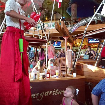 Margaritaville - Myrtle Beach - One of the balloon entertainers on stilts making a flower for my daughter. - American Near Me - Myrtle Beach, South Carolina