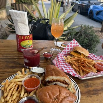AhbA - Fried chicken sammie Sour cherry gin slushie  Instagram: @hungrytamale - Breakfast & Brunch Near Me - Laguna Beach, California