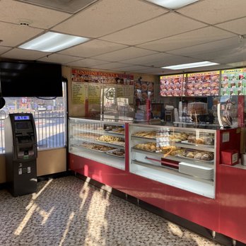 Sunshine Donuts & Water - a woman standing in front of the counter - Donuts Near Me - Montebello, California Sunshine Donuts & Water - a woman standing in front of the counter - Donuts Near Me - Montebello, California