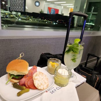 Delta Sky Club - Vegetarian slider, cheese and meats, lemon and mango pudding, mojito - Airport Lounges Near Me - San Francisco, California Delta Sky Club - Vegetarian slider, cheese and meats, lemon and mango pudding, mojito - Airport Lounges Near Me - San Francisco, California