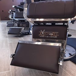 Latch Life Barber Shop - The barber chairs are high quality, brown leather and feature embroidered logos.