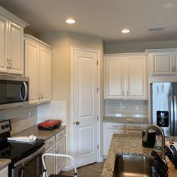 N-Hance Wood Refinishing of Sarasota - This kitchen went from dark brown to clean crisp white in two days!