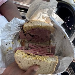 Pastrami sandwich on rye with deli mustard. Pastrami sandwich on rye with deli mustard.